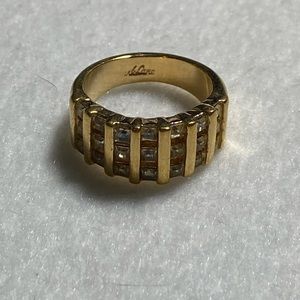 Park Lane gold toned ring with several clear stones, size 6.75